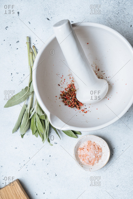 Crushed herbs with a mortar and pestle