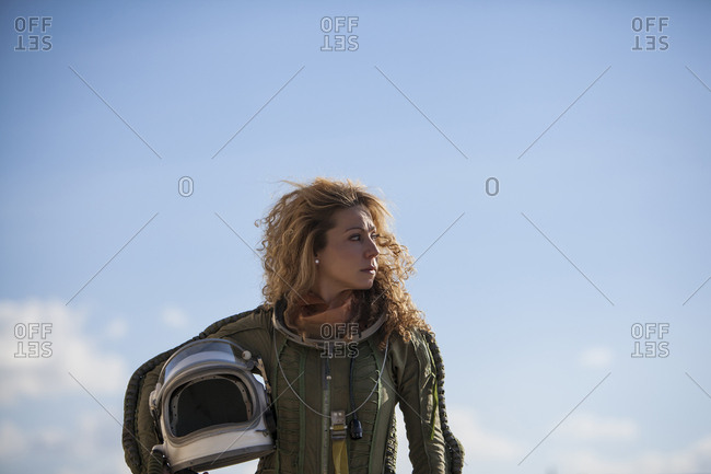 beautiful and young blonde dressed as russian aeronautic pilot, portrait Front half-length portrait without a helmet