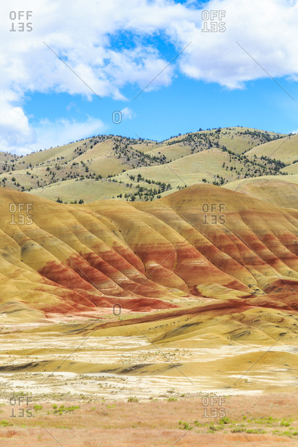USA, Oregon, Redmond, Bend, Mitchell. Series of low clay hills striped in colorful bands of minerals, ash and clay deposits.