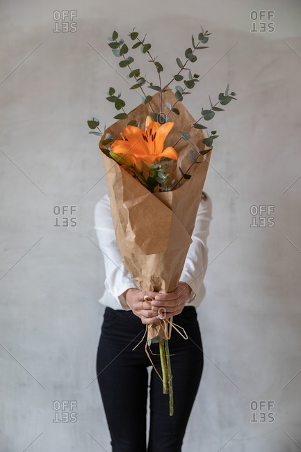 Young girl holding a bouquet of flowers