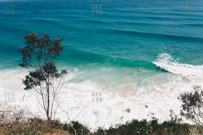 Scenic view of ocean waves breaking in Byron Bay