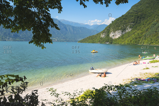 August 24, 2017: Bathers on the shores of Lake Idro, Valle Sabbia, Brescia province, Lombardy, Italy, Europe