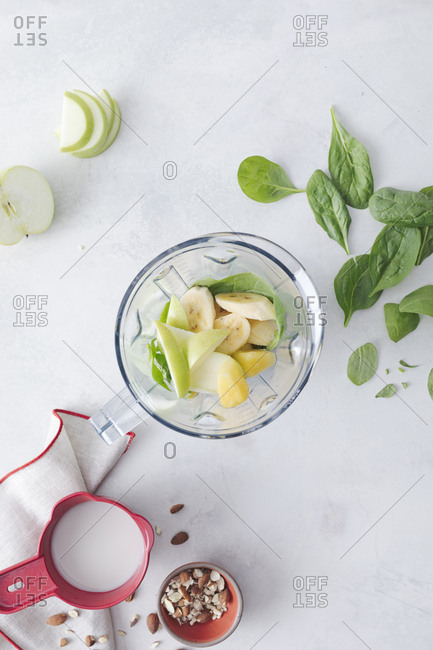 Smoothie and ingredients in a blender