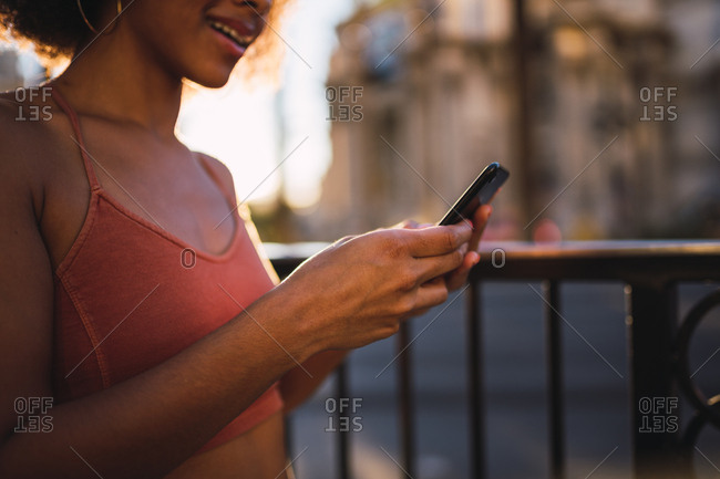USA- Nevada- Las Vegas- close-up of young woman using cell phone in the city