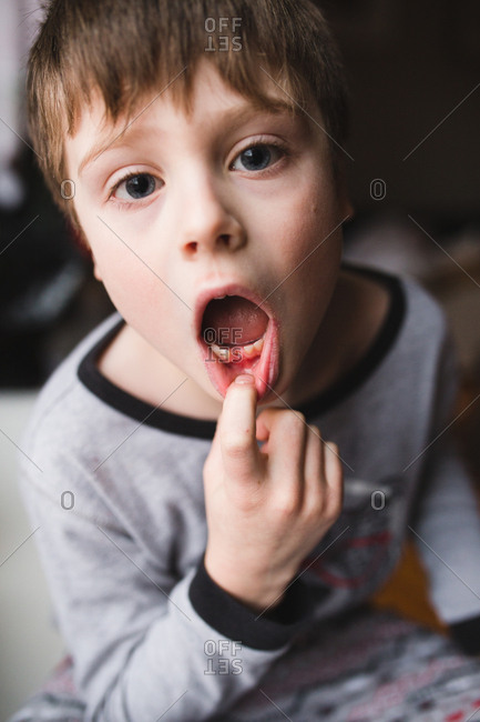 young boy mouth caucasian little boy amazed by news with opened mouth ...