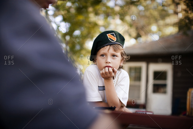 boy wearing army cap