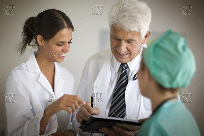 View of three doctors involved in a discussion.