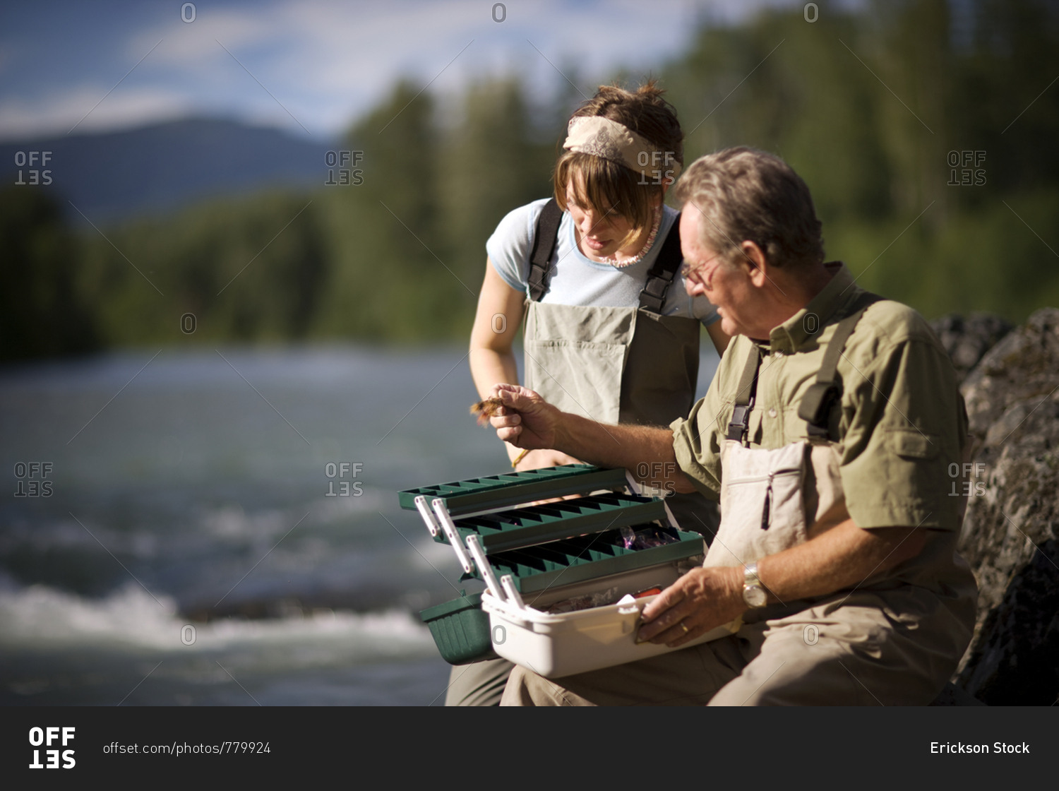 Father and adult daughter fly fishing together