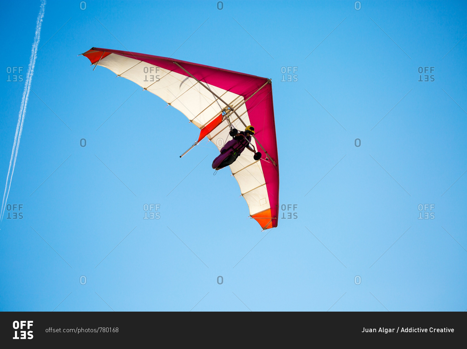 Anonymous person flying on hand glider