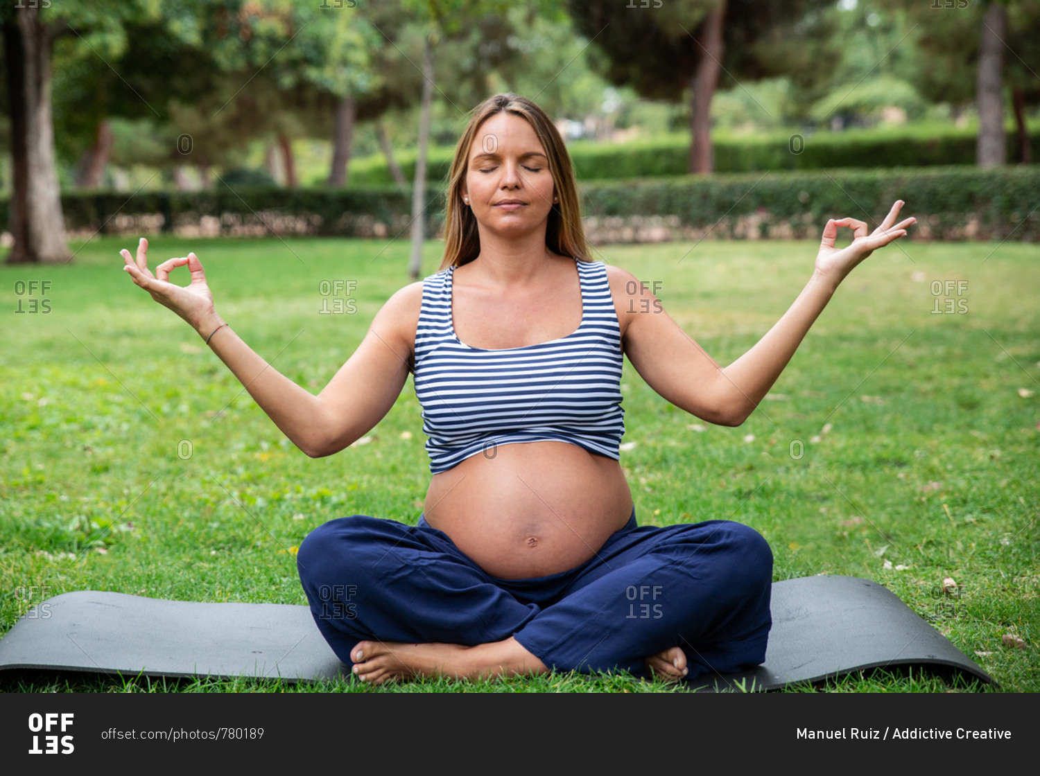 young-pregnant-lady-in-sportswear-meditating-in-lotus-pose-on-yoga-mat