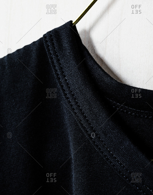Close up of the collar of a black t-shirt