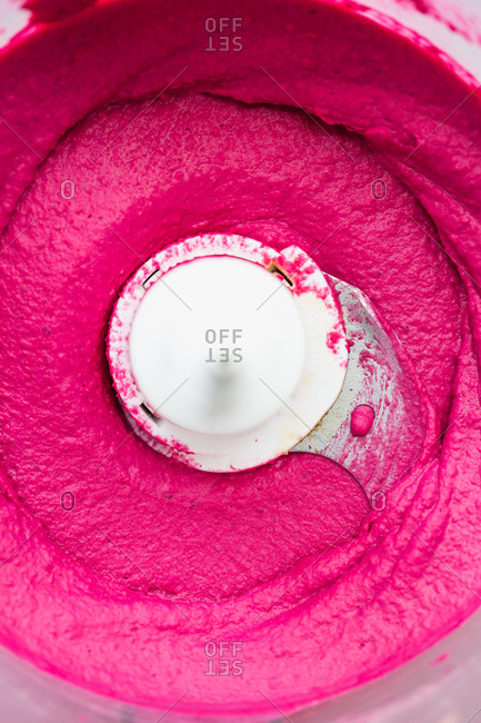 Close-up of hot pink heat hummus in food processor