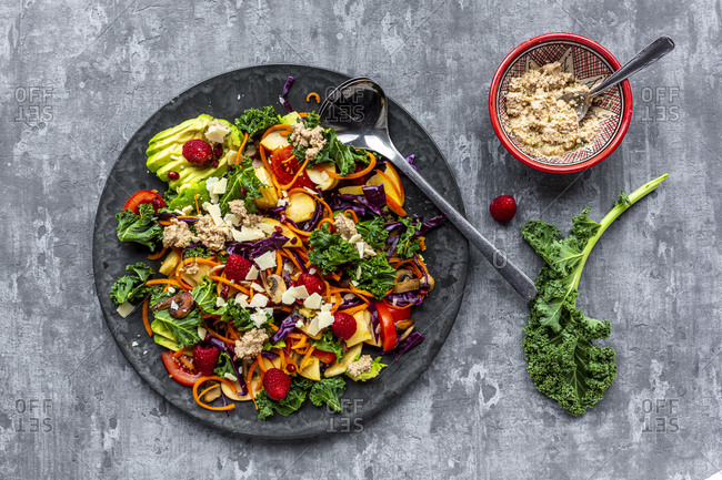 Kale avocado salad with red cabbage- tomato- fried mushroom- carrot- apple and raspberry
