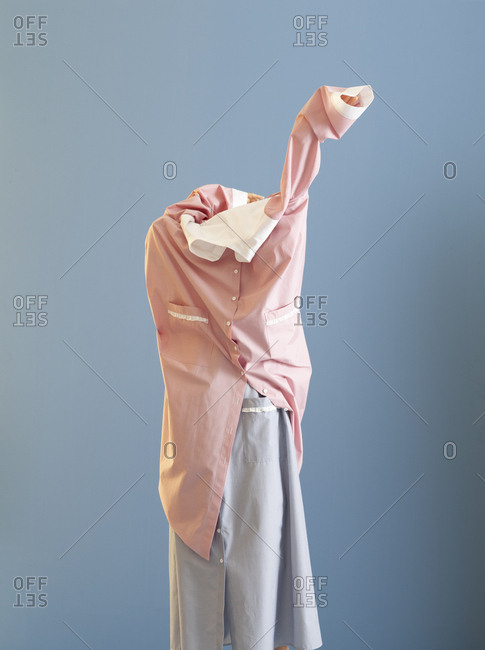 Model trying to wear a dress on a dress