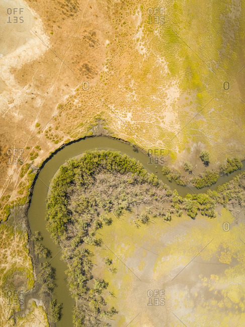 Aerial view above of a serpentine stream with riparian forest, Brazil.
