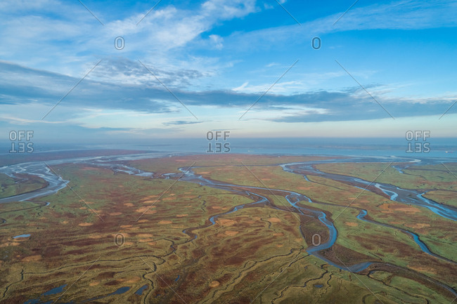 Aerial view of wide wetland ecosystem near the ocean, Netherlands.