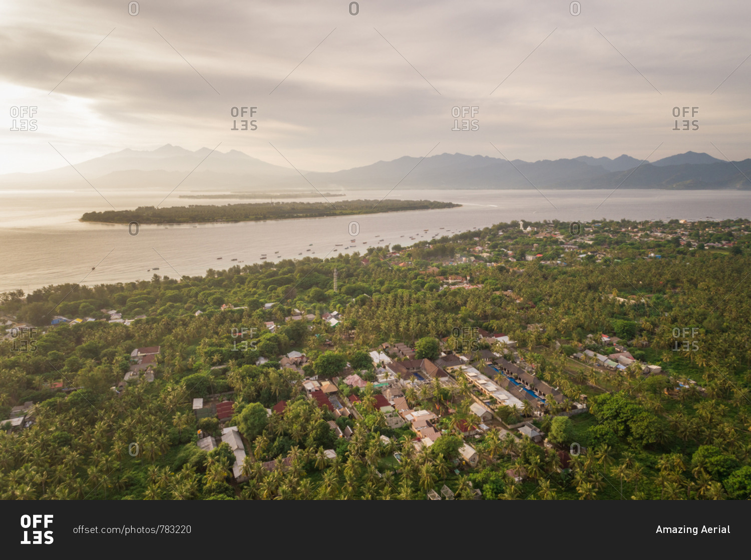 Aerial view of Pemenang city surrounding by tropical forest, Lombok island, Indonesia.
