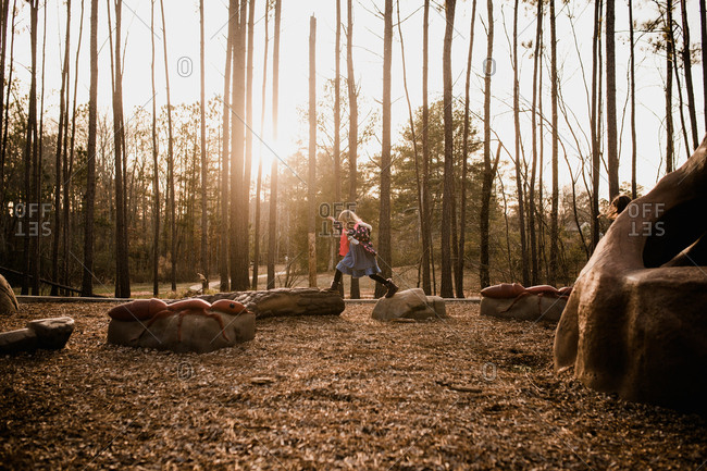 Little girl jumping at a playground