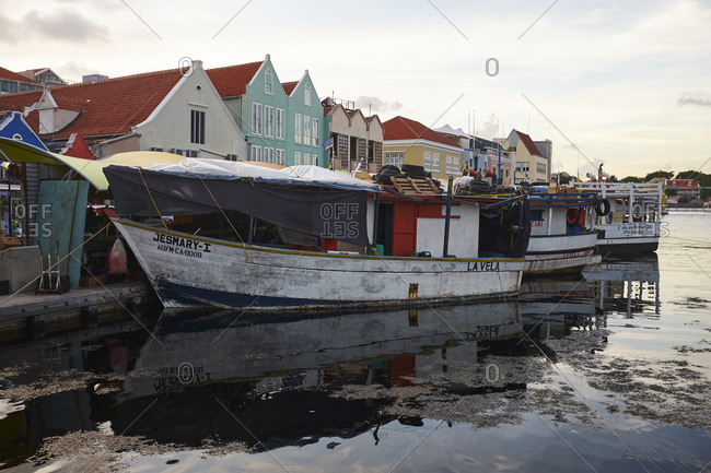 Willemstad, Curacao - October 31, 2018: Historic and colorful waterfront buildings of the Punda district of Willemstad. The Dutch architecture has UNESCO World Heritage Site status.