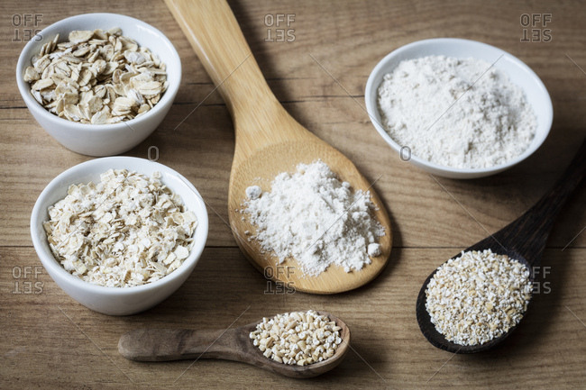 Two variations of oat flakes- oat bran- oatmeal and steel-cut oats