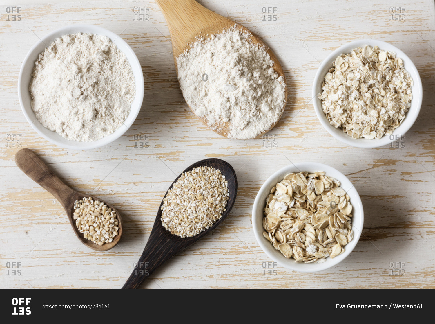 Two variations of oat flakes- oat bran- oatmeal and steel-cut oats