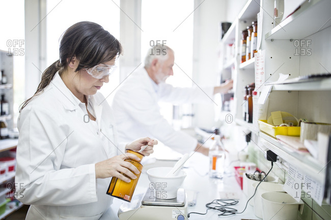 Man and woman working in laboratory of a pharmacy