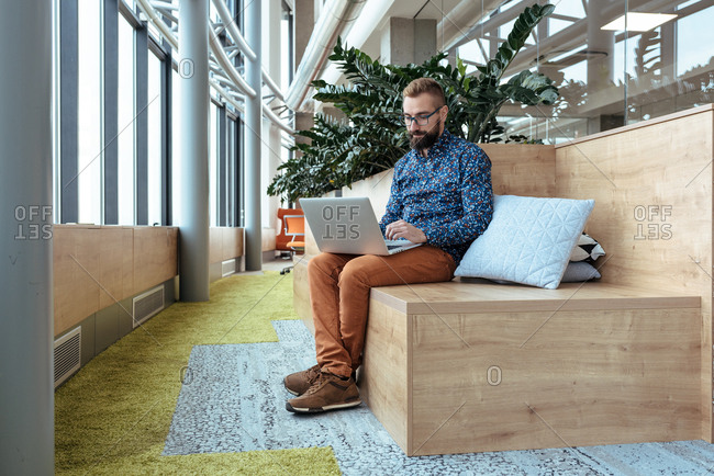 Man working on his computer at modern open space office