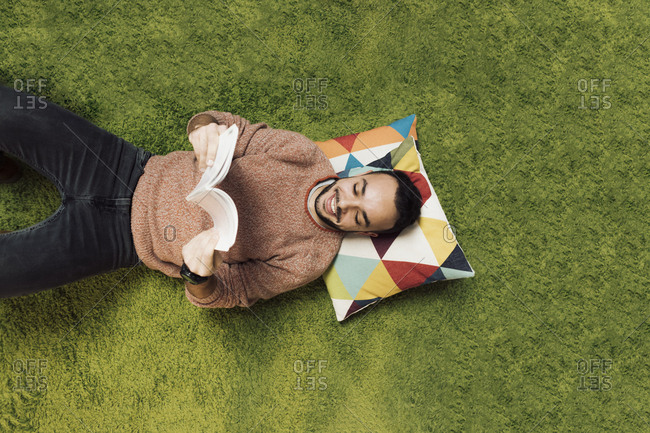 Creative man draws inspiration from a book