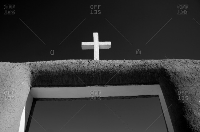 Cross above entrance on the San Francisco de Asis Mission Church, Taos, New Mexico