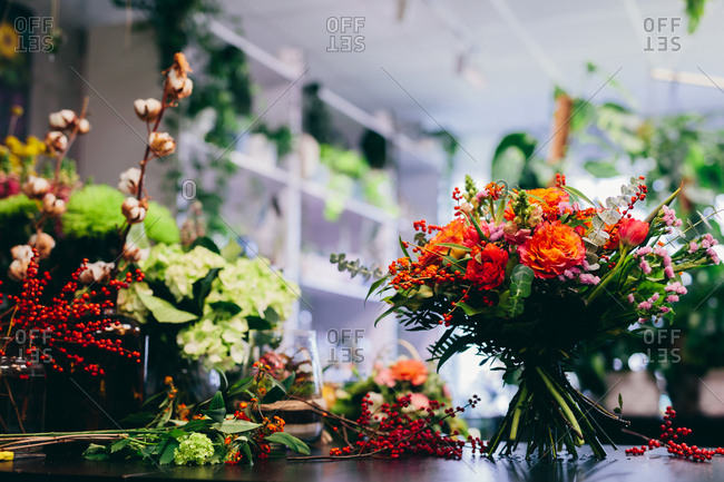 Flower shop counter with bouquet. Florist, small business, retailing. Natural floral decoration.