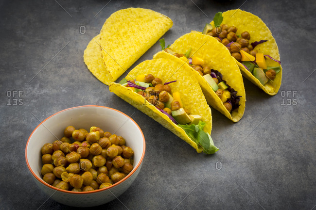 Vegetarian tacos with curcuma- roasted chickpeas- paprika- avocado- salad and red cabbage