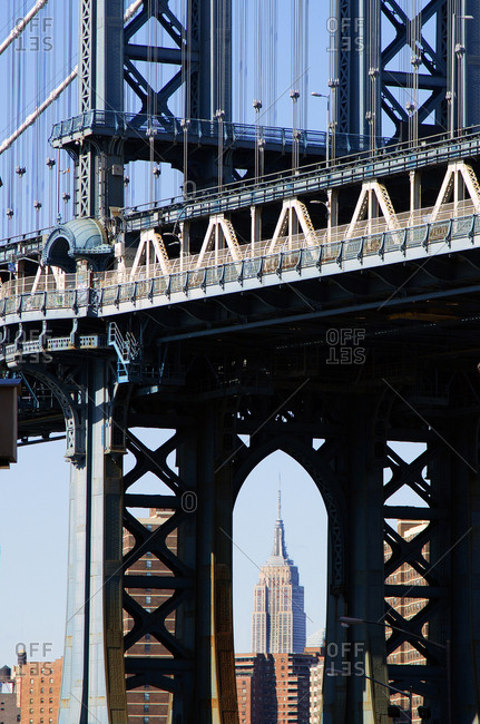 New York City, NY - April 11, 2015: Manhattan Bridge and Empire state building in distance