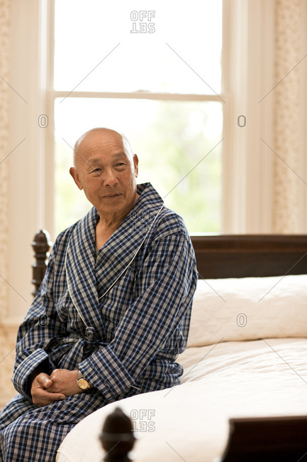 Portrait of unwell senior man in his room.