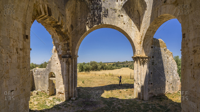 June 12, 2017: Italy, Tuscany, Magliano in Toscana . detail of the ruins of the 11th-century abbey of San Bruzio in Magliano in Tuscany, in Romanesque architectural style and elegant sculptures in the style of the Lombardian. Magliano in Toscana is a comune (municipality) in the Province of Grosseto in the Italian region Tuscany.