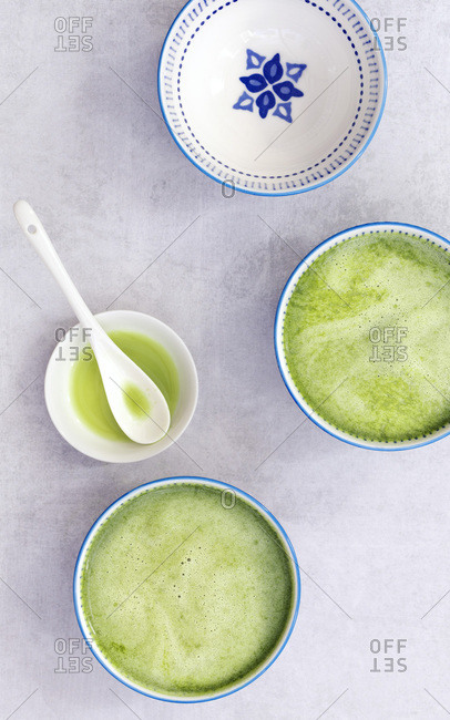 Brewed matcha green tea in Japanese tea cups.