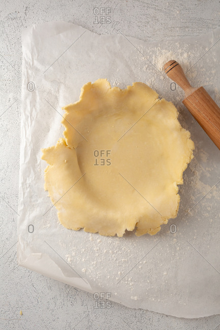 Placing pie crust dough on a pan