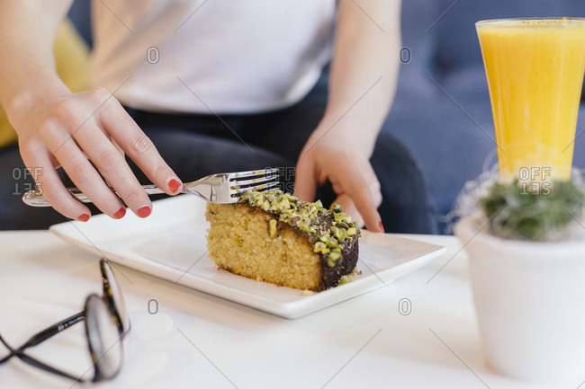 Woman heating slice of cake