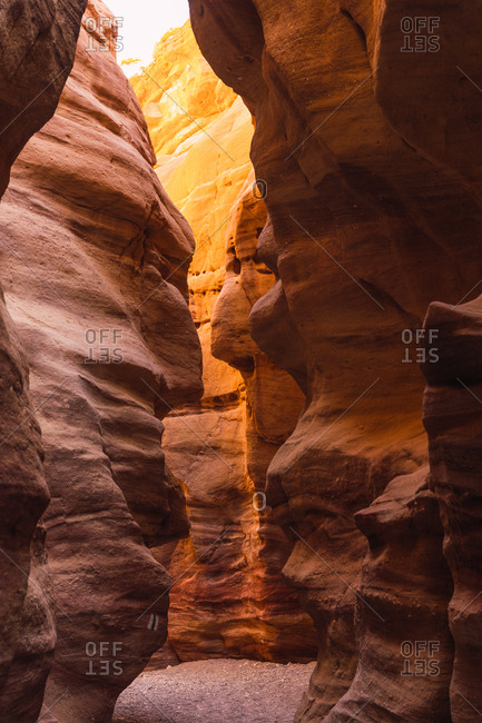Narrow passage in between rough walls in majestic Red Canyon in Negev Desert
