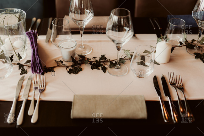 Place setting at a wedding reception with vine decoration