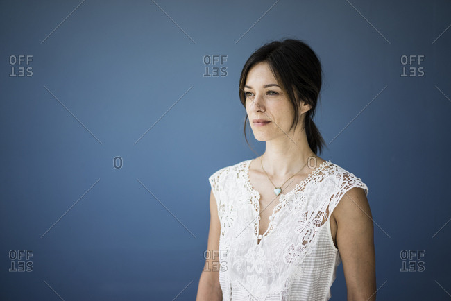 Portrait of a beautiful woman against blue background