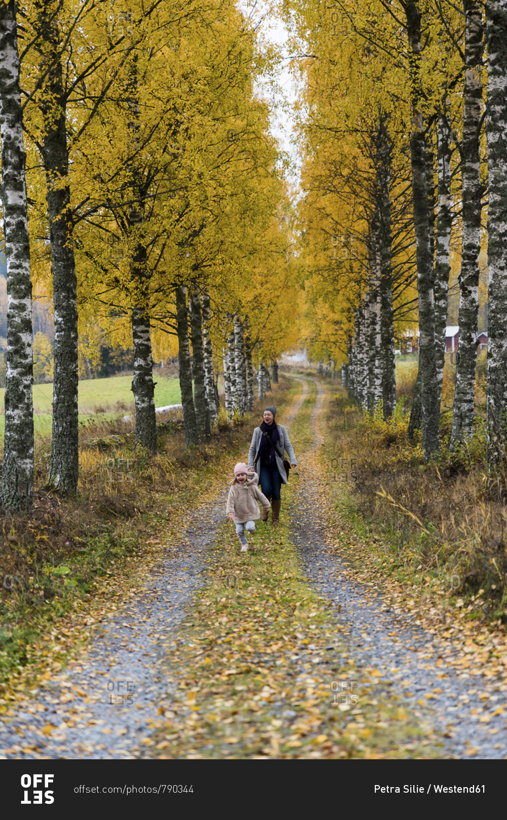 Finland- Kuopio- mother and little daughter strolling together in autumn