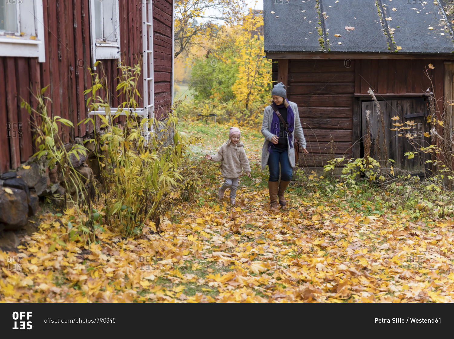 Finland- Kuopio- mother and little daughter playing together in autumn