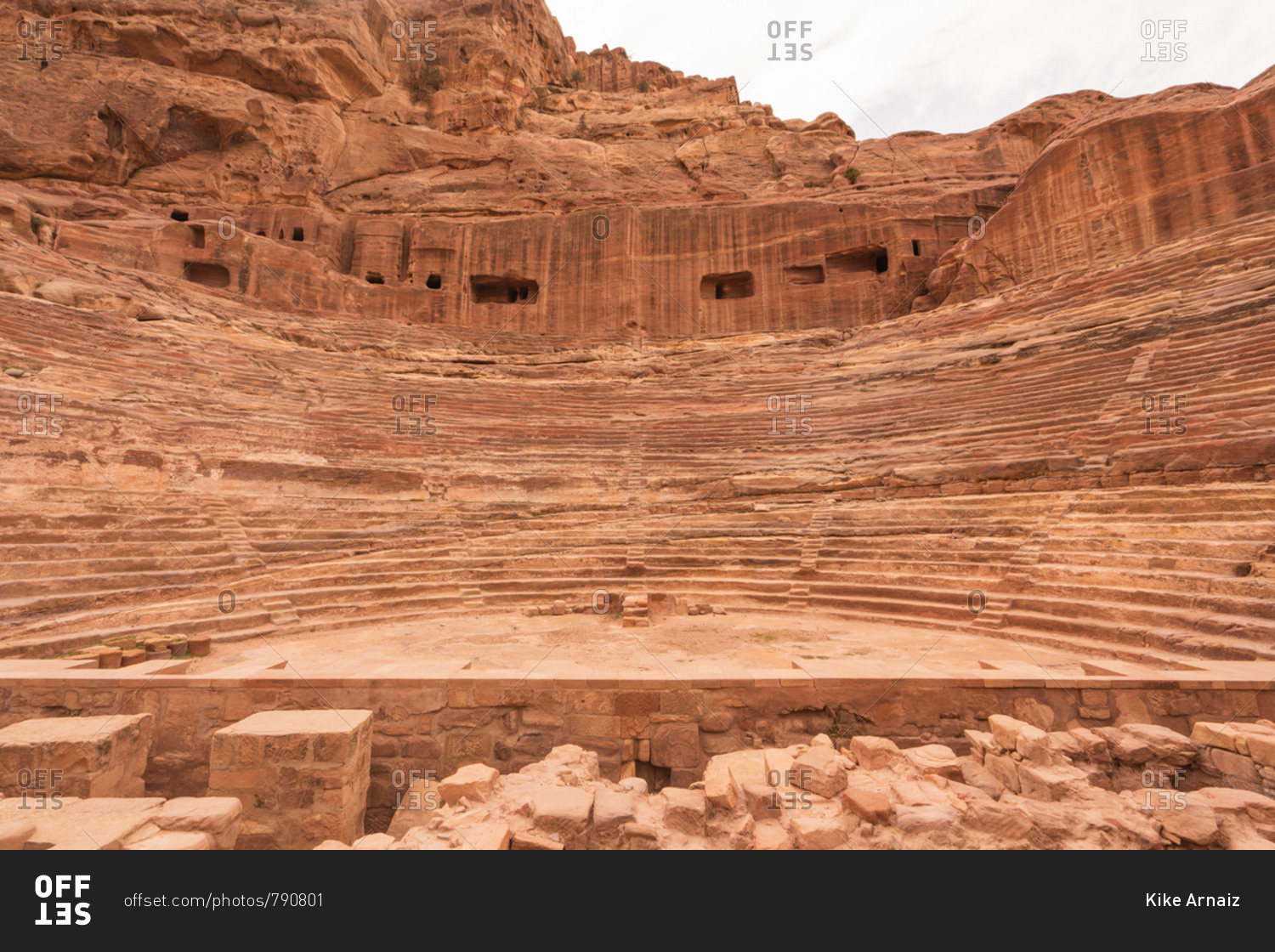 Remnants of beautiful amphitheater carved in solid cliff in Petra city, Jordan