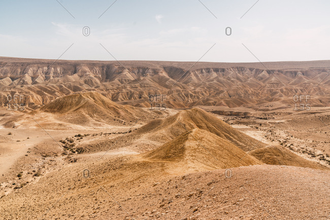 Panorama of majestic hot Negev desert with spacious dry valley in sunshine, Israel