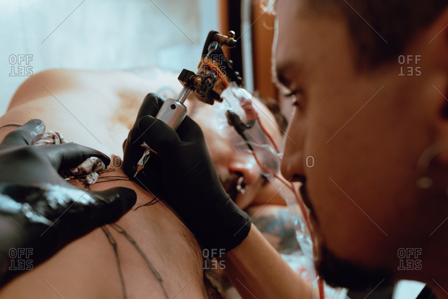 Stylish woman making tattoo