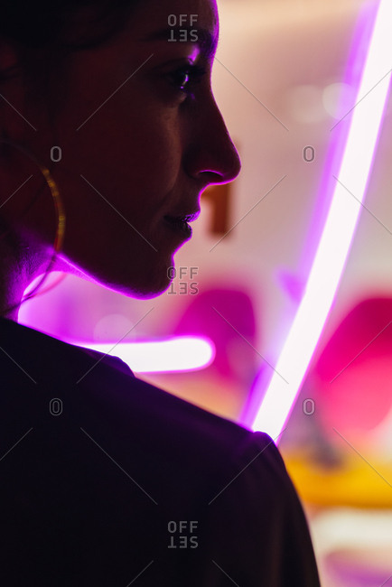 Attractive stylish lady near neon lights