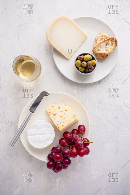 cheese and grapes appetizer with wine