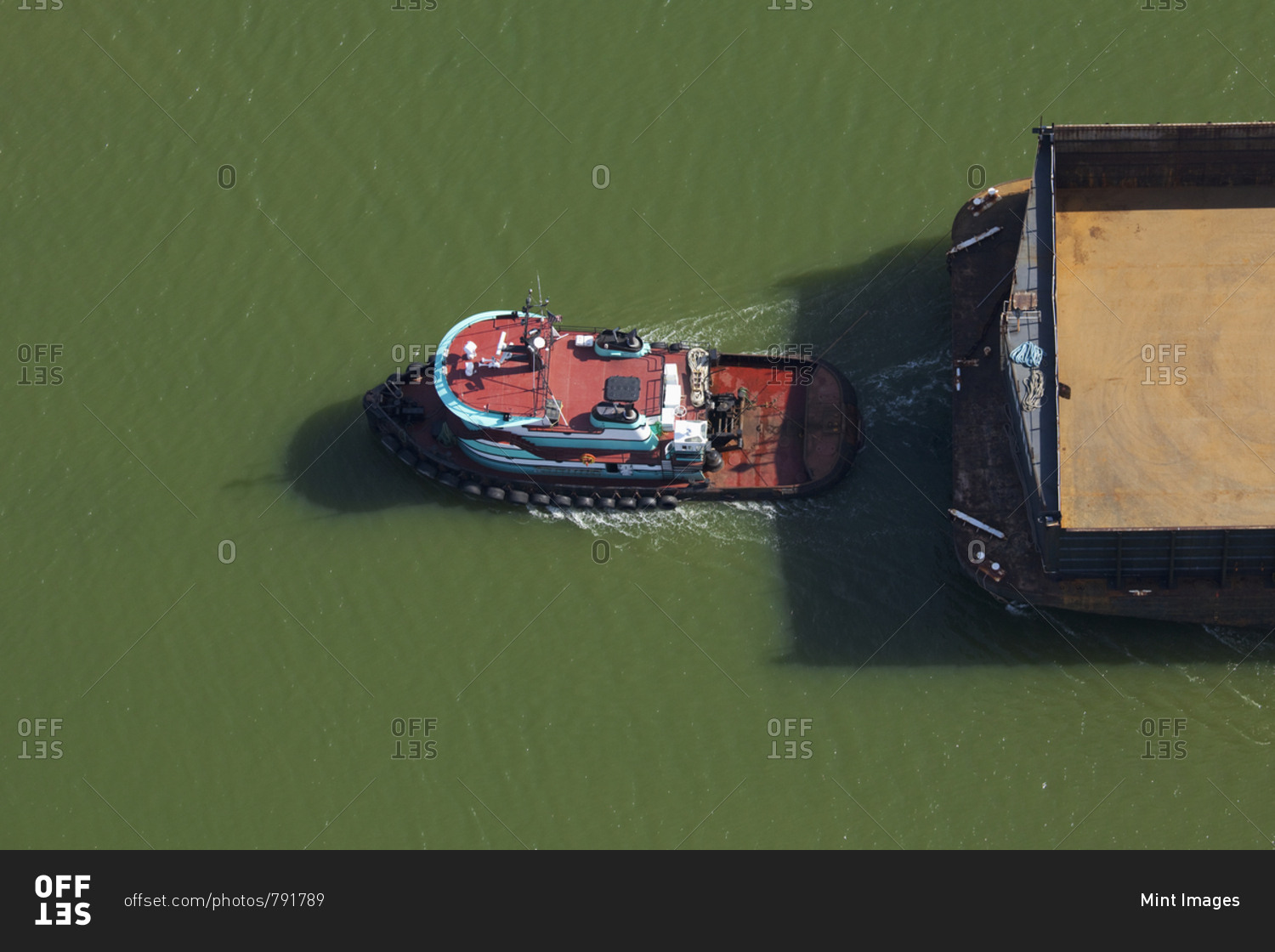 Tugboat pulling barge