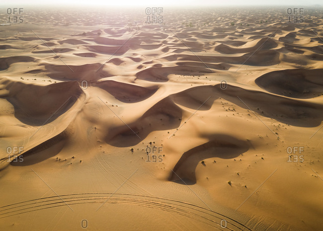 Aerial view of dunes creating shadows at a desertic landscape, U.A.E.