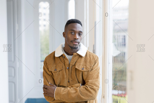 Portrait of young man with shaved head and beard